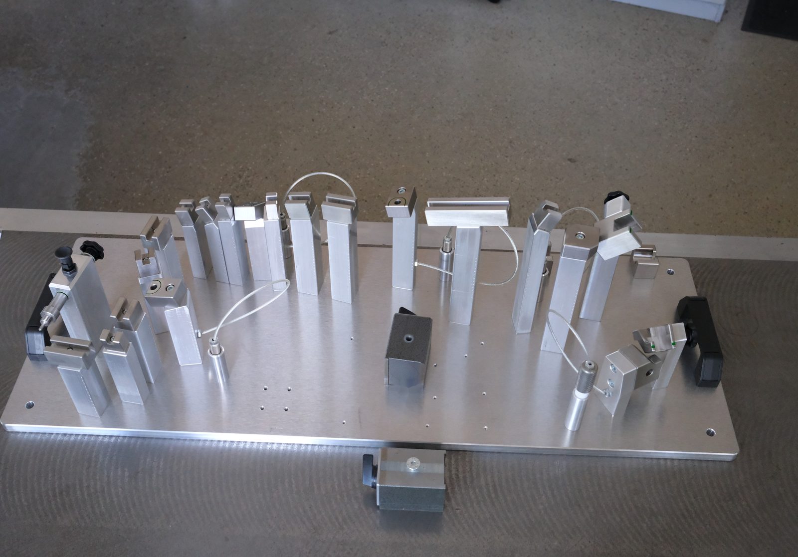 Checking fixture with locators, stops and check pins on the inspection table, built by CAD-IS, Germany